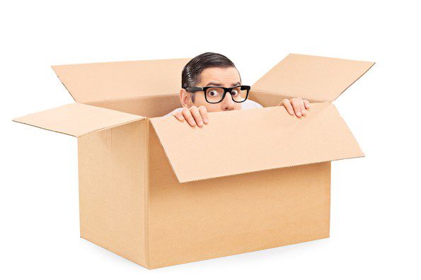 Man hiding in box